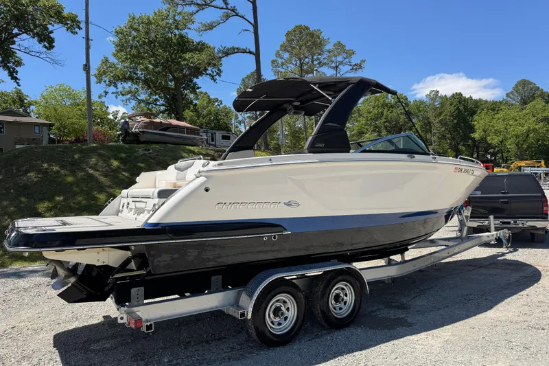 Slide: The Image of 2021 Chaparral 287 SSX boat on trailer, parked outdoors on a sunny day. - 4