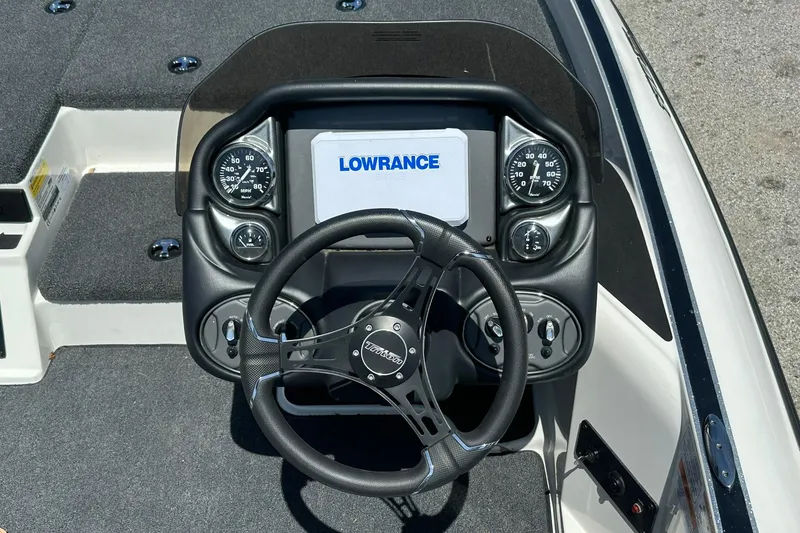 Slide: The Image of Steering console of 2026 Triton 179 TrX boat with Lowrance display and gauges. - 12