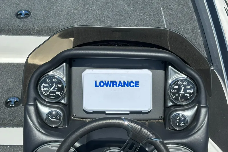 Slide: The Image of Dashboard of 2026 Triton 179 TrX boat with Lowrance display and gauges. - 13