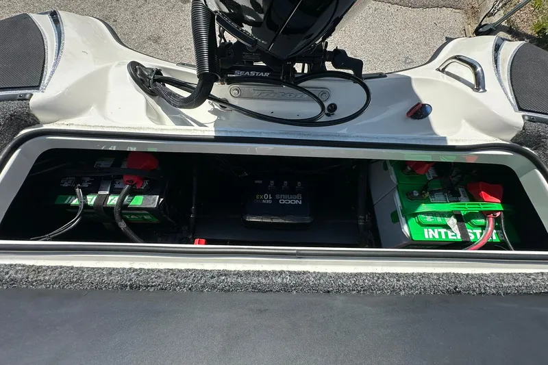 Slide: The Image of Battery compartment of 2026 Triton 179 TrX boat with Interstate batteries and wiring. - 22