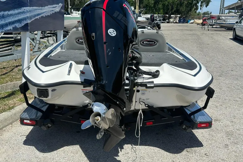 Slide: The Image of 2026 Triton 179 TrX boat with powerful outboard motor on trailer. - 27