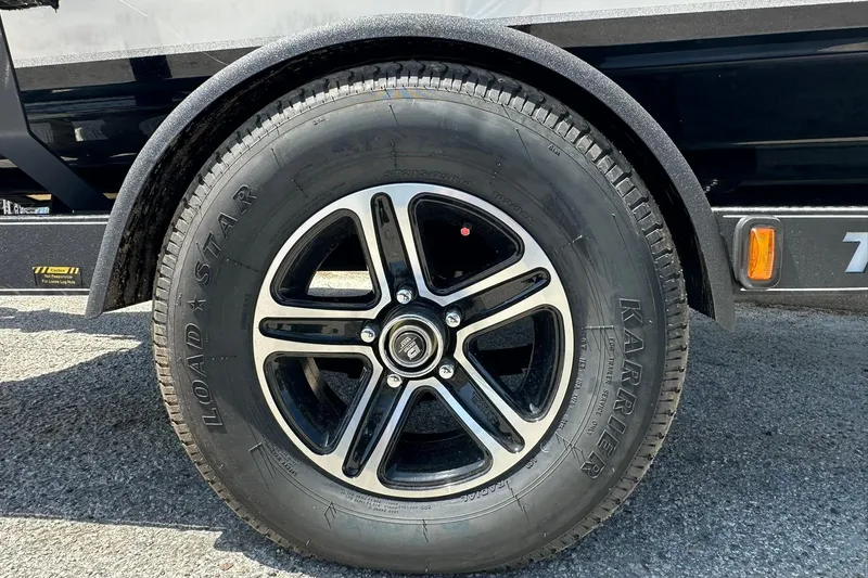 Slide: The Image of Close-up of a 2026 Triton 179 TrX trailer wheel with Load Star tire. - 30
