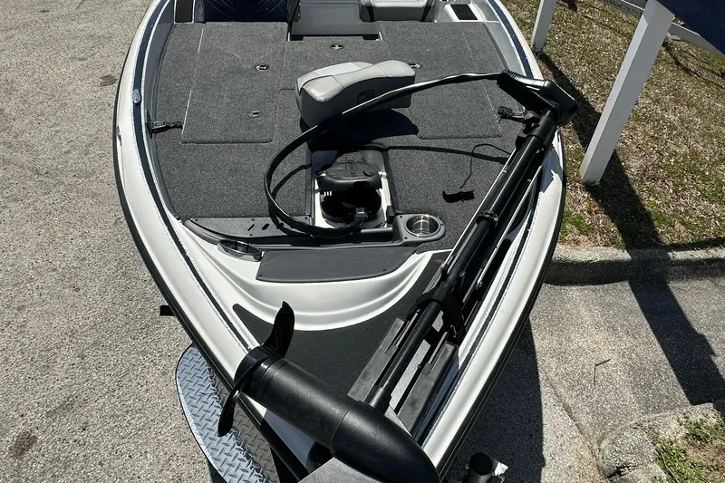 Slide: The Image of 2026 Triton 179 TrX boat with trolling motor on a sunny day. - 5