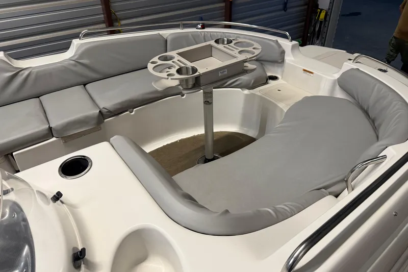 Slide: The Image of 2014 Starcraft 1915 OB Limited boat interior with gray seating and a central table. - 10