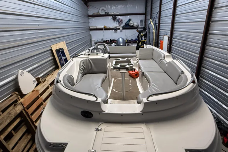Slide: The Image of 2014 Starcraft 1915 OB Limited boat in storage, featuring spacious seating and modern design. - 4