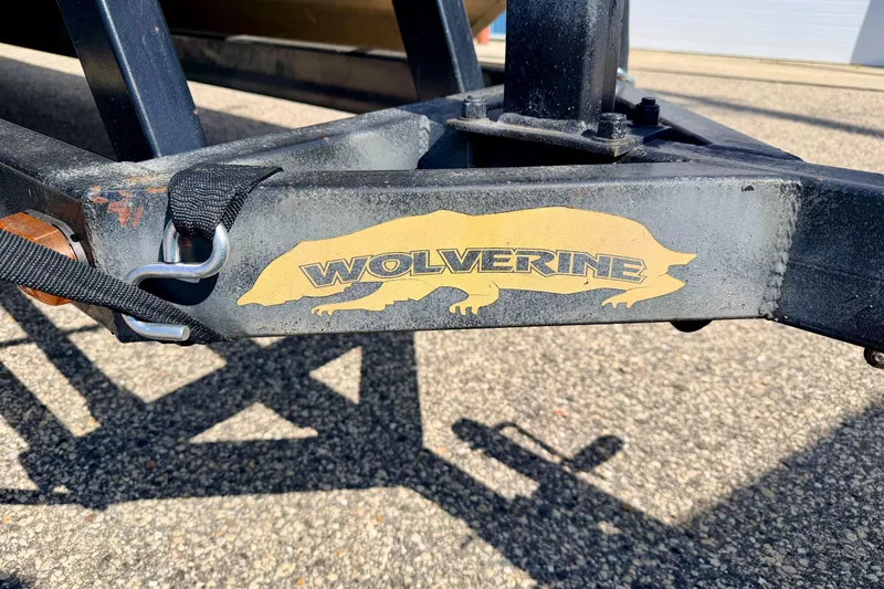 Slide: The Image of Trailer hitch with "Wolverine" logo on a Bennington 2050 LX, 2001 model. - 10