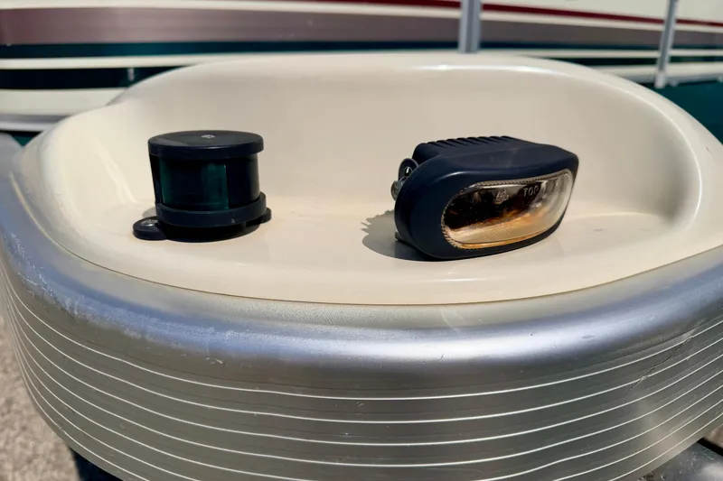 Slide: The Image of Close-up of a 2001 Bennington 2050 LX boat's navigation light and fixture. - 11