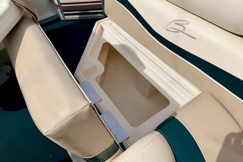 Slide: The Image of Open storage compartment in a 2001 Bennington 2050 LX boat seat. - 27