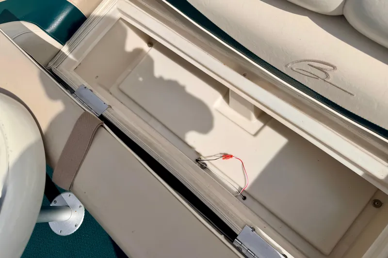 Slide: The Image of Open storage compartment on a 2001 Bennington 2050 LX boat, showing interior details. - 31