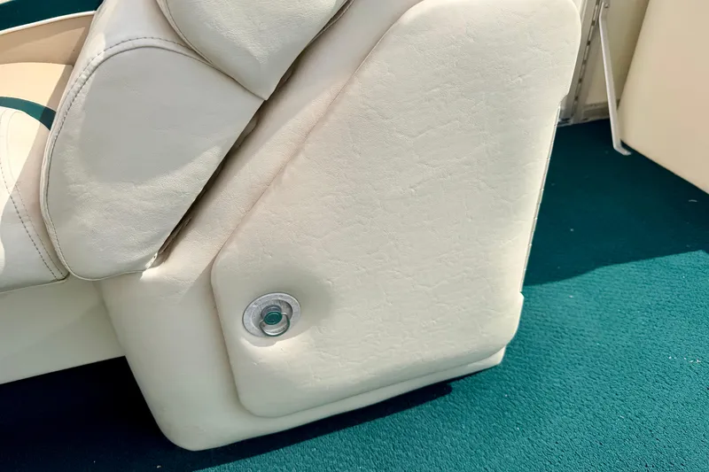 Slide: The Image of Close-up of a 2001 Bennington 2050 LX boat seat with white upholstery. - 43