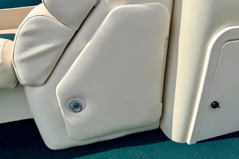 Slide: The Image of Close-up of a 2001 Bennington 2050 LX boat seat with beige upholstery. - 45