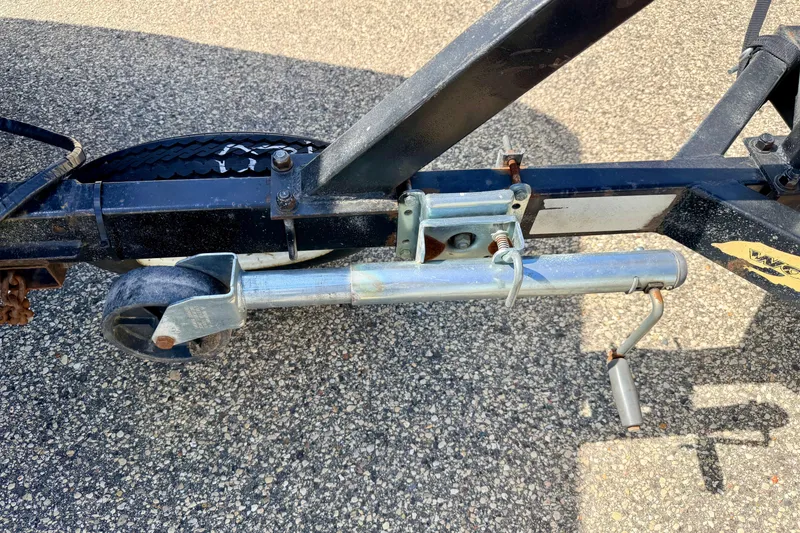 Slide: The Image of Trailer hitch and wheel assembly on a 2001 Bennington 2050 LX boat trailer. - 71