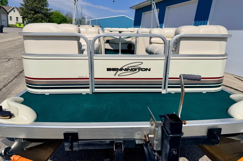 Slide: The Image of 2001 Bennington 2050 LX pontoon boat on trailer, parked outdoors. - 8