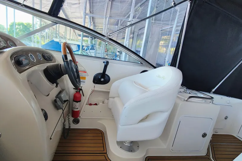 Slide: The Image of Interior of a 2001 Sea Ray Sundancer 260 with helm station. - 13