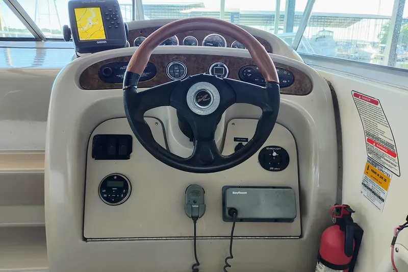Slide: The Image of Steering console of a 2001 Sea Ray Sundancer 260 boat. - 16