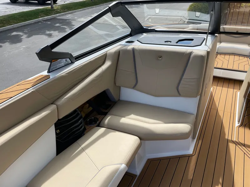 Slide: The Image of Interior of 2026 Nautique G25 with beige leather seating. - 10
