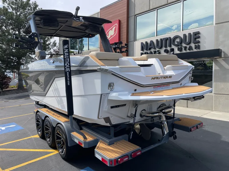 Slide: The Image of 2026 Nautique G25 boat outside a Utah dealership. - 3