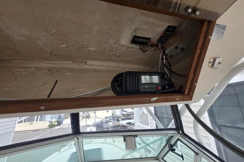 Slide: The Image of Interior view of a 1989 Sea Ox 250C boat showing electronic equipment and wiring. - 12
