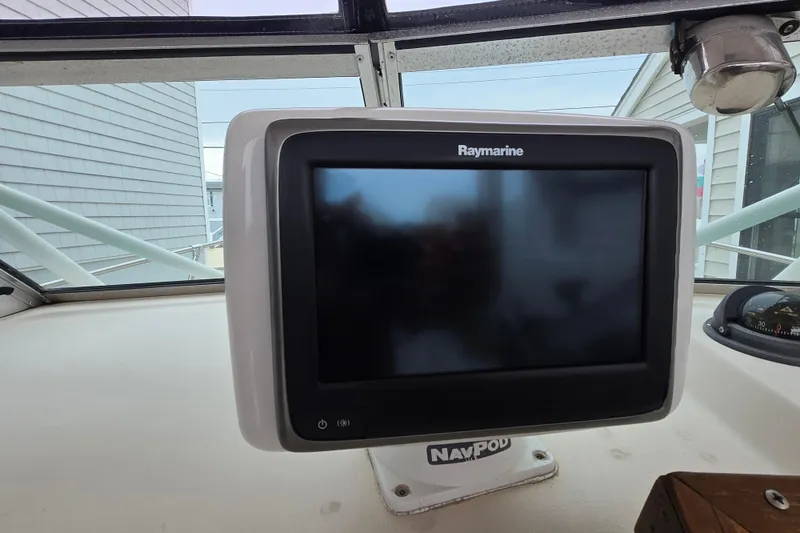 Slide: The Image of Raymarine navigation display on 1989 Sea Ox 250C boat dashboard. - 15