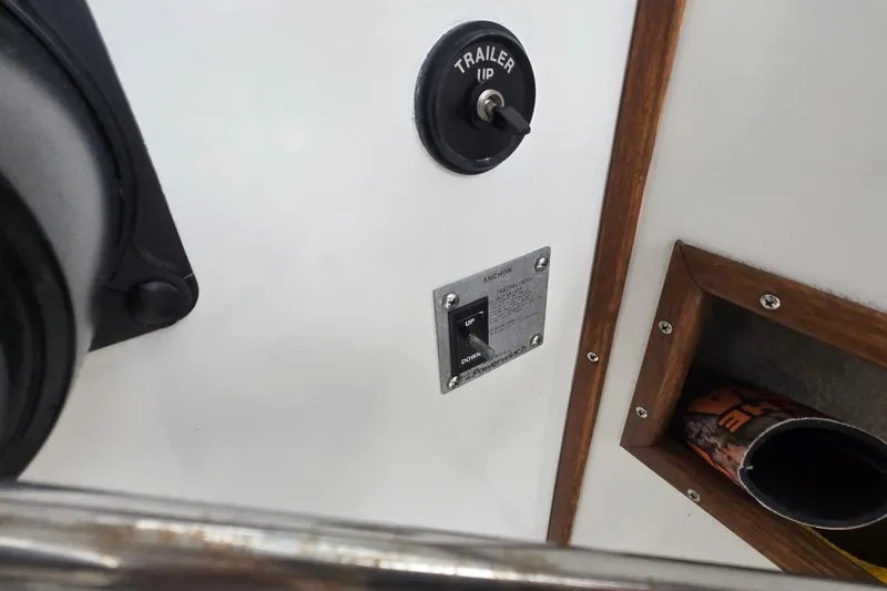 Slide: The Image of Control panel of a 1989 Sea Ox 250C boat with trailer and anchor switches. - 18
