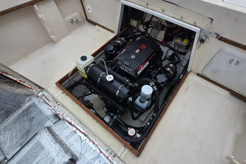 Slide: The Image of Engine compartment of a 1989 Sea Ox 250C boat, featuring a MerCruiser Magnum engine. - 5