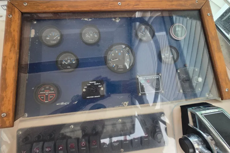 Slide: The Image of Dashboard of a 1989 Sea Ox 250C boat with gauges and controls. - 8