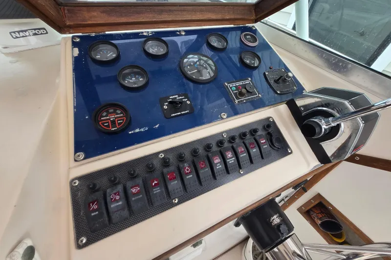 Slide: The Image of Control panel of a 1989 Sea Ox 250C boat with gauges and switches. - 9