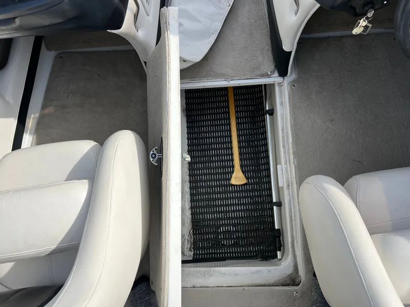Slide: The Image of Interior of a 2003 Crownline 225 LPX boat with storage compartment. - 10