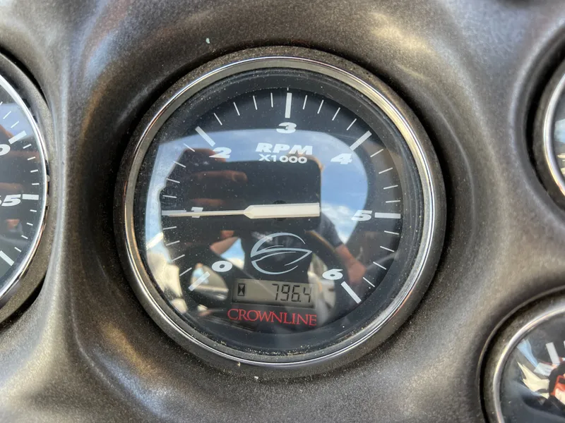 Slide: The Image of Tachometer of a 2003 Crownline 225 LPX boat, displaying 795.4 hours. - 11
