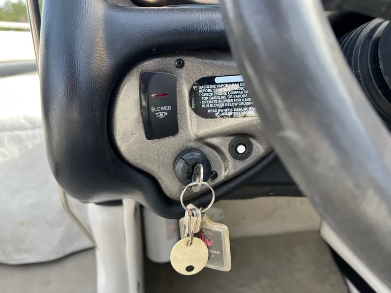 Slide: The Image of Ignition key and blower switch of a 2003 Crownline 225 LPX boat. - 14