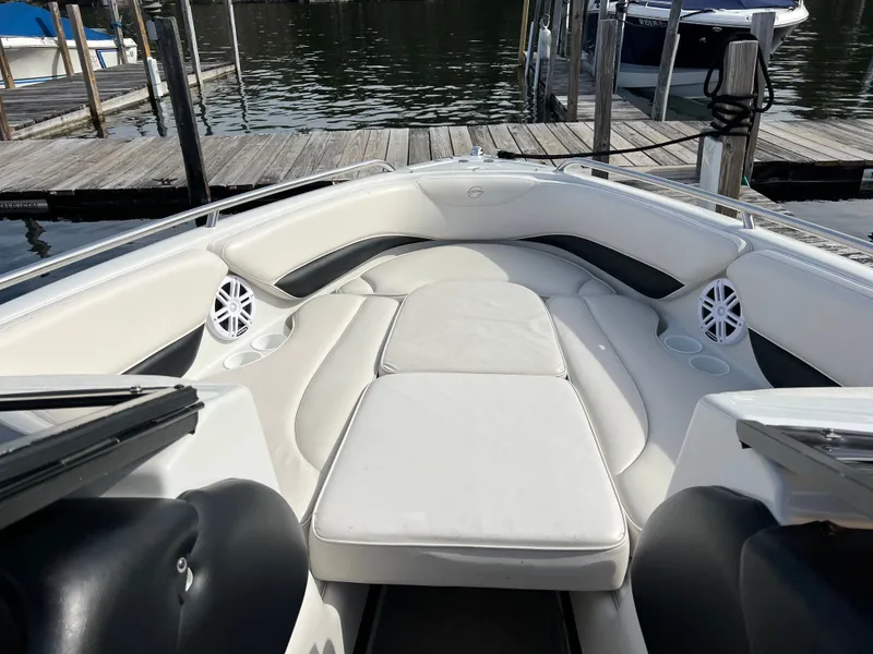 Slide: The Image of Interior of a 2003 Crownline 225 LPX boat at the dock. - 17