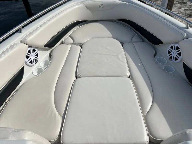 Slide: The Image of Interior of a 2003 Crownline 225 LPX boat with white upholstery. - 18