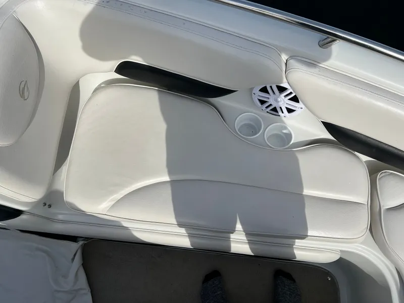 Slide: The Image of Interior of a 2003 Crownline 225 LPX boat with speaker and cup holders. - 19