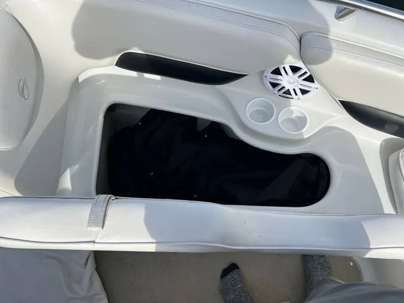 Slide: The Image of Interior of a 2003 Crownline 225 LPX boat with speaker and cup holders. - 20