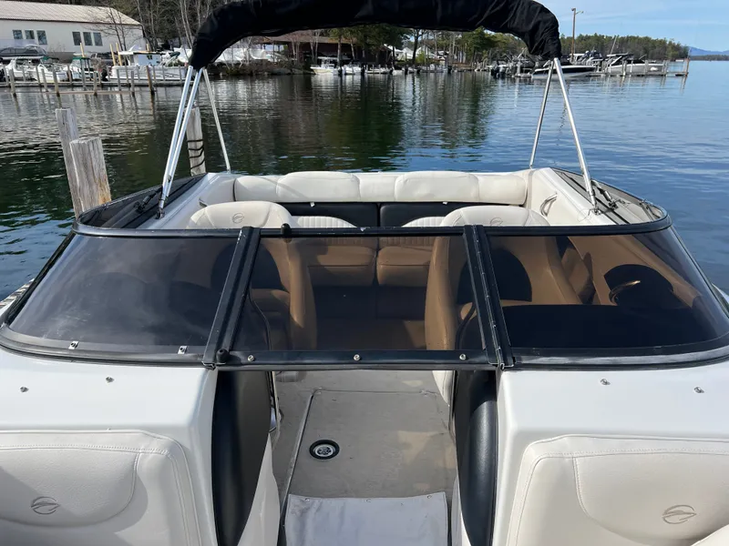 Slide: The Image of 2003 Crownline 225 LPX boat at lakeside dock. - 23