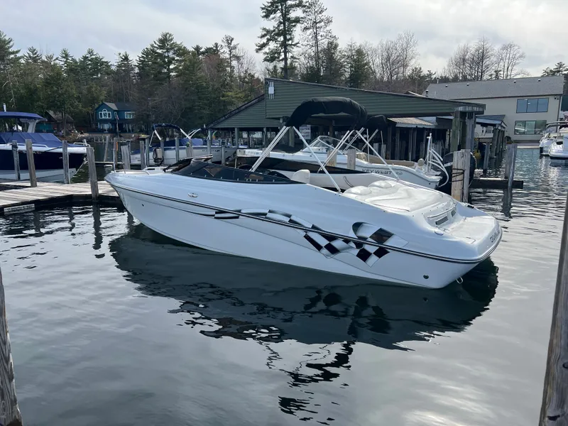 Slide: The Image of 2003 Crownline 225 LPX boat docked in harbor, calm waters. - 3
