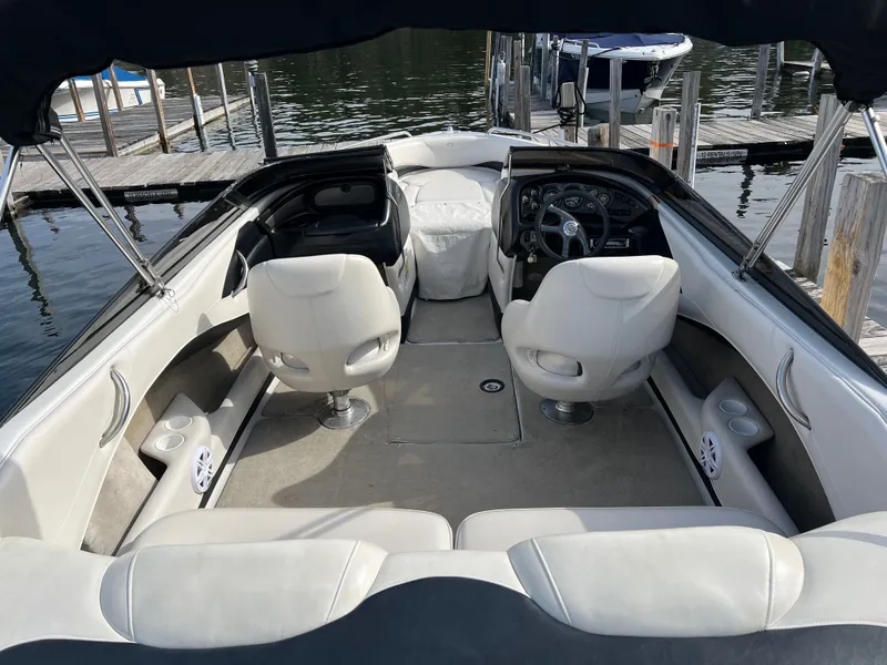 Slide: The Image of Interior of a 2003 Crownline 225 LPX boat at the dock. - 4