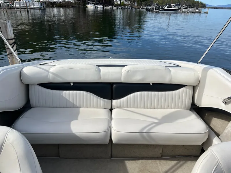 Slide: The Image of Interior of a 2003 Crownline 225 LPX boat by the water. - 5