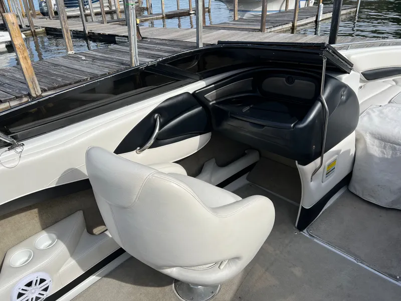 Slide: The Image of Interior of a 2003 Crownline 225 LPX boat at the dock. - 8