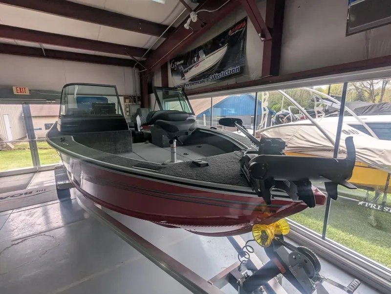 Slide: The Image of 2026 G3 AV1850SF boat in showroom, red, featuring modern equipment. - 3