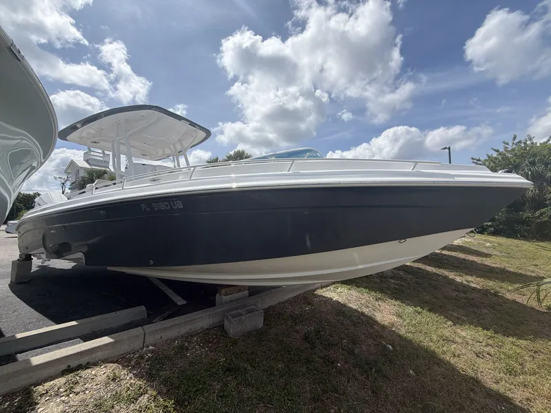 The Image of 2024 Glasstream 280 SCX boat parked under blue sky. - 1