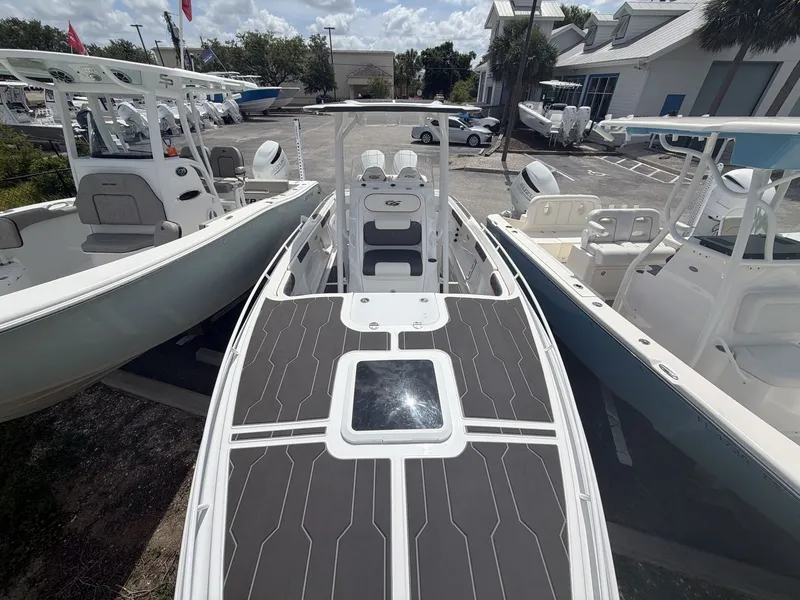 Slide: The Image of 2024 Glasstream 280 SCX boat displayed in a parking lot. - 7
