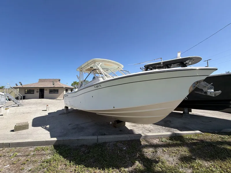 Slide: The Image of 2022 Grady-White Freedom 275 boat on a parking lot. - 10