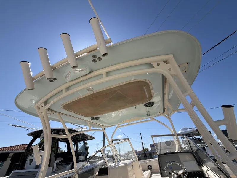 Slide: The Image of 2022 Grady-White Freedom 275 boat with sunshade and fishing rod holders. - 12