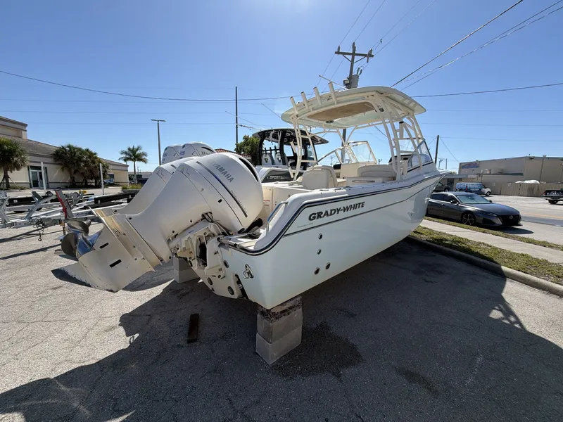 Slide: The Image of 2022 Grady-White Freedom 275 boat with Yamaha engines on a parking lot. - 18