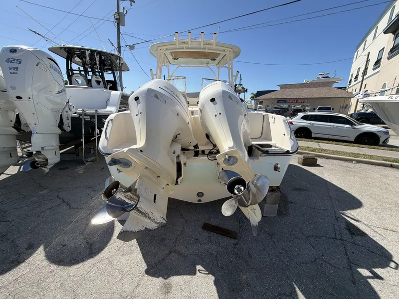 Slide: The Image of 2022 Grady-White Freedom 275 boat with dual engines in parking lot. - 20