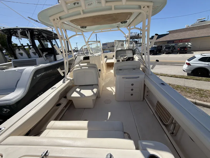 Slide: The Image of Interior view of a 2022 Grady-White Freedom 275 boat at the dock. - 22