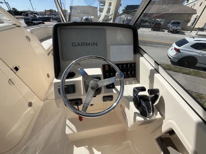Slide: The Image of Grady-White Freedom 275 helm, 2022 model, featuring Garmin navigation system. - 23