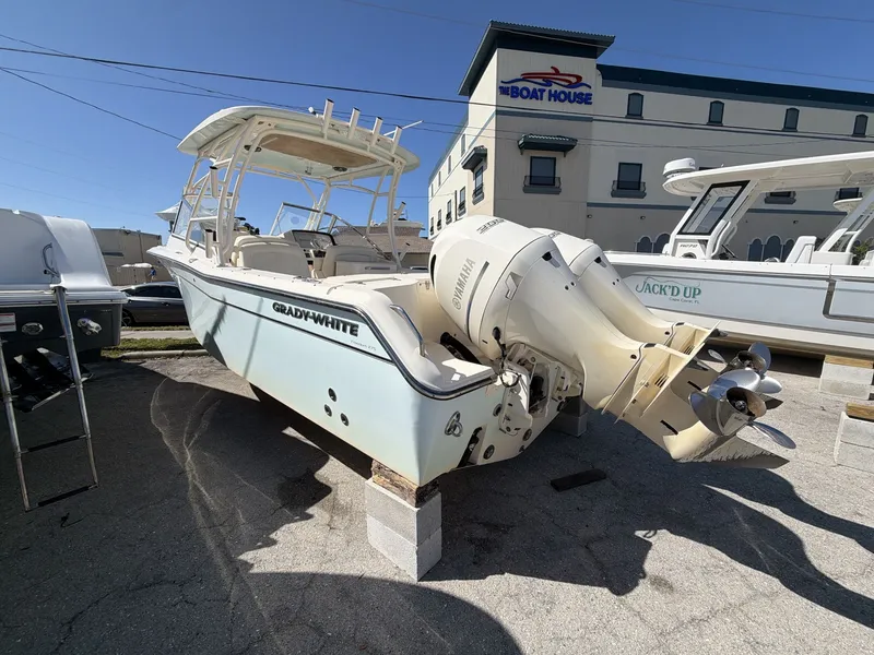 Slide: The Image of 2022 Grady-White Freedom 275 boat on a parking lot. - 5