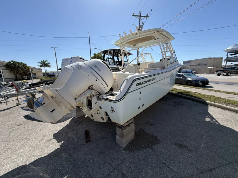 Slide: The Image of 2022 Grady-White Freedom 275 boat with Yamaha engines on a parking lot. - 7